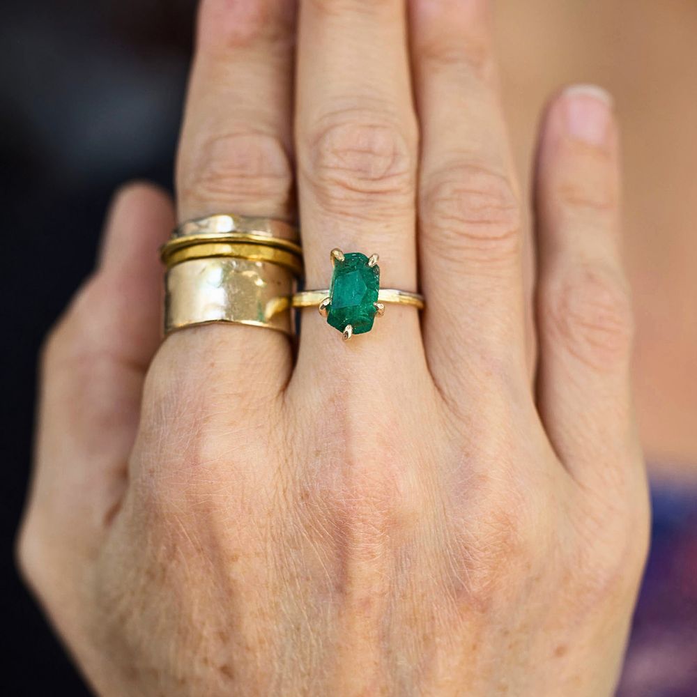 Zambian Emerald Medium Stone Ring on a Yellow Gold Embedded Band
