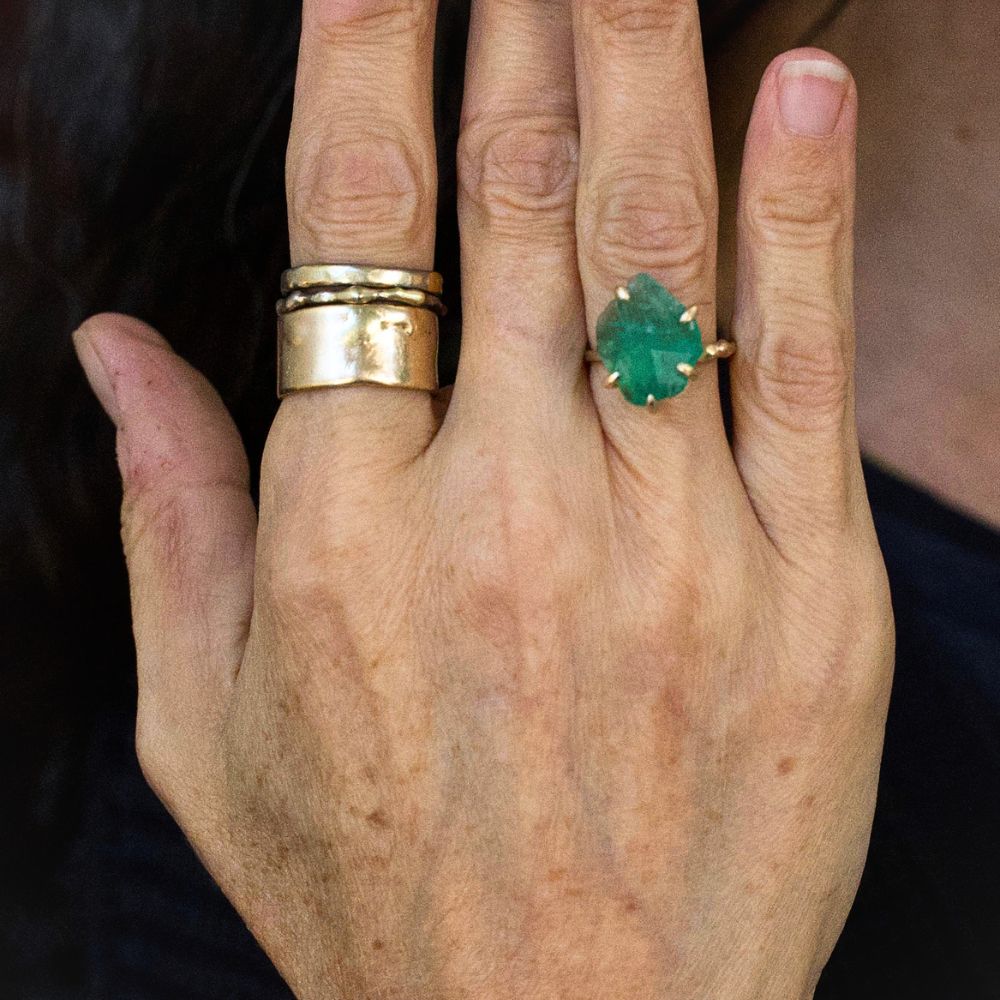 Zambian Emerald Medium Stone Ring on a Yellow Gold Embedded Band