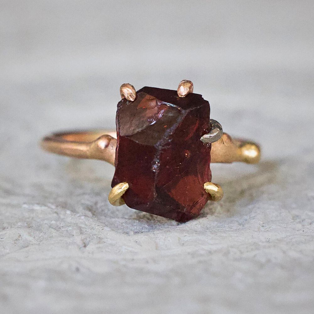 Garnet Small Stone Ring on a Yellow Gold Band