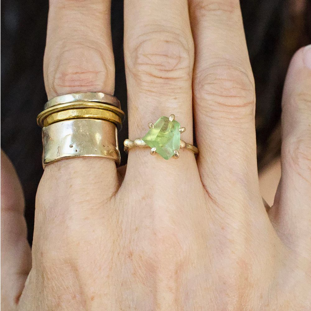 Peridot Small Stone Ring on a Yellow Gold Embedded Band