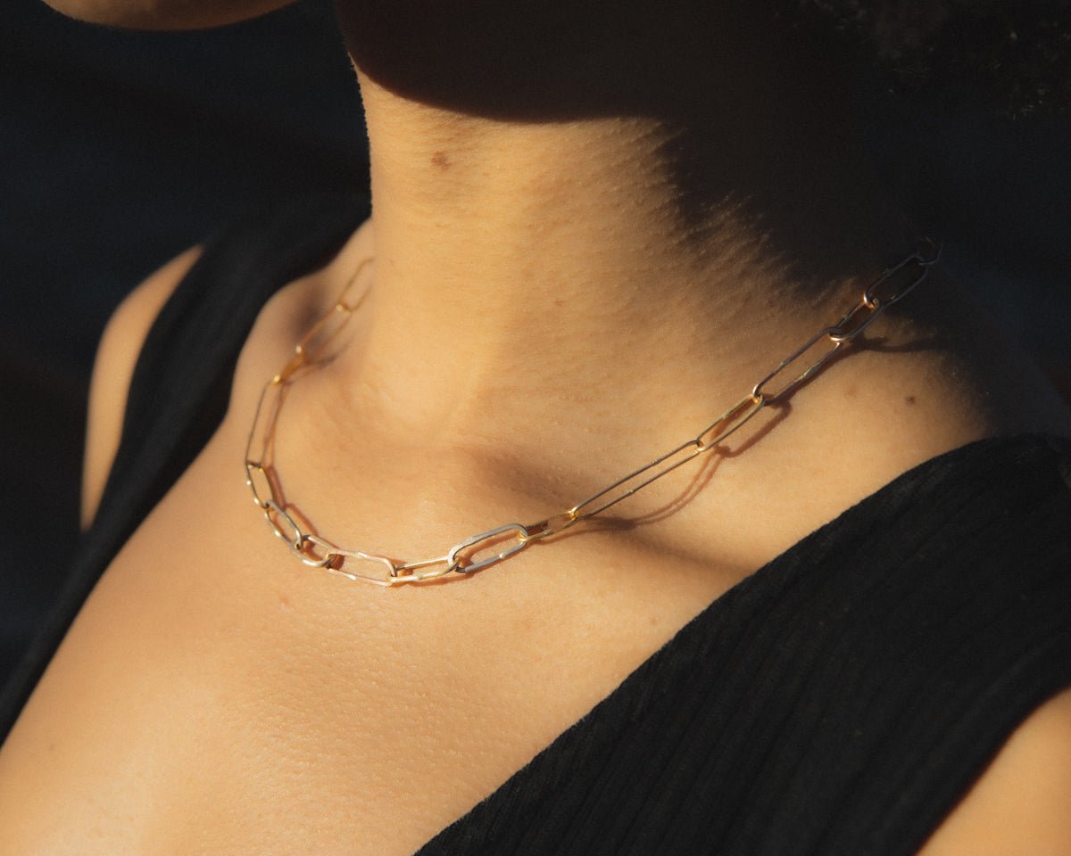 Lady wearing heavy gold link chain