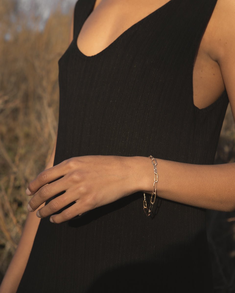 Lady wearing heavy gold link bracelet