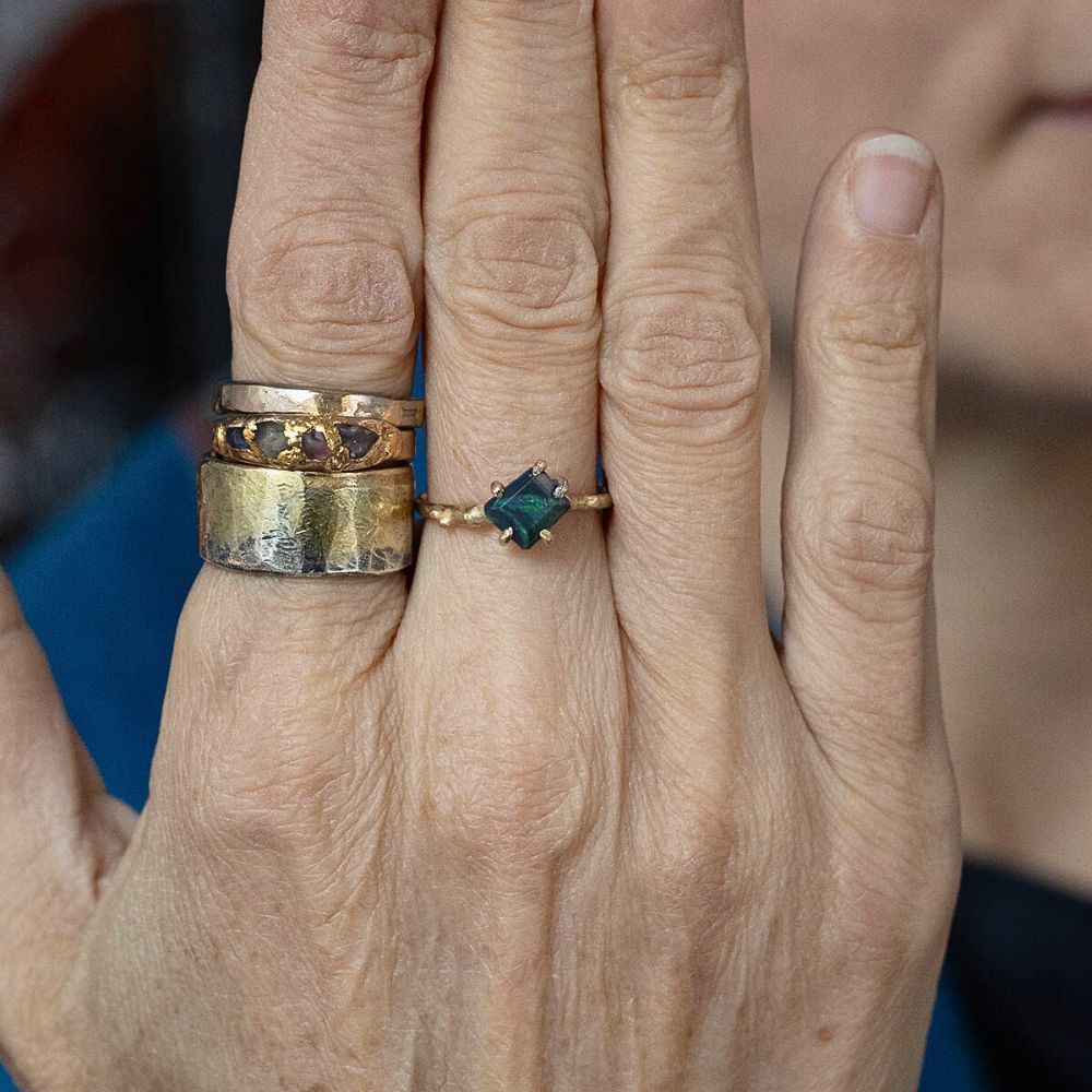 Australian Dark Opal Small Stone Ring on a Yellow Gold Band