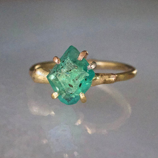 Zambian Emerald Small Stone Ring on a Yellow Gold Embedded Band