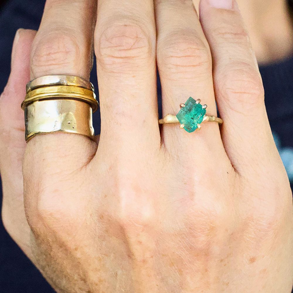 Zambian Emerald Small Stone Ring on a Yellow Gold Embedded Band