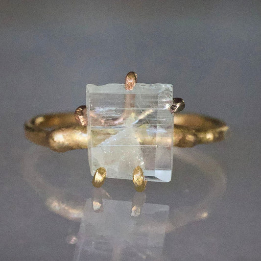 Aquamarine Small Stone Ring on a Yellow Gold Embedded Band