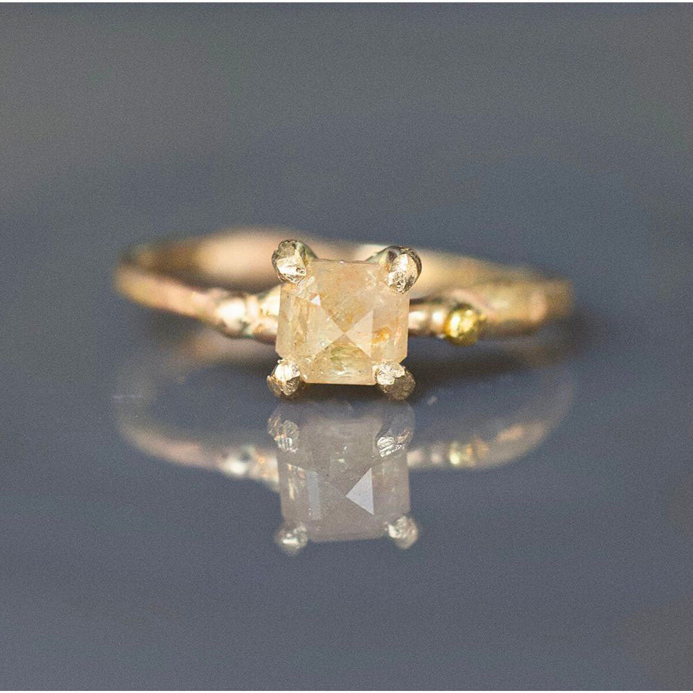 Peach .9CT Emerald Cut Diamond Ring on a Yellow Gold Band