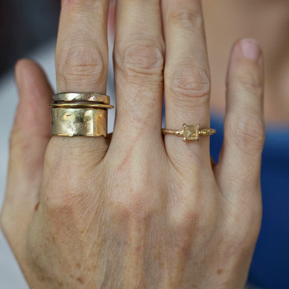 Peach .9CT Emerald Cut Diamond Ring on a Yellow Gold Band