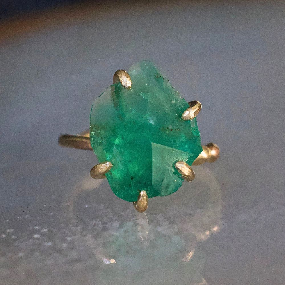 Zambian Emerald Medium Stone Ring on a Yellow Gold Embedded Band