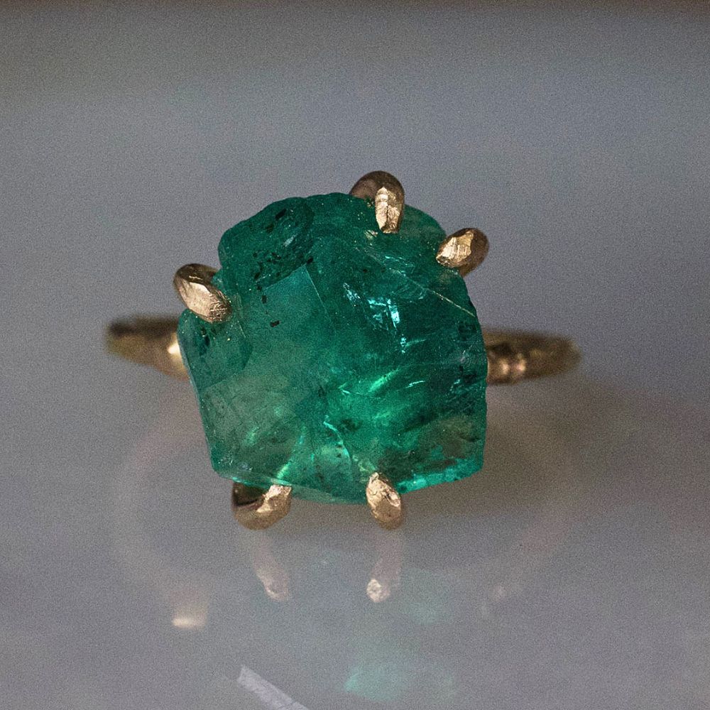 Zambian Emerald Medium Stone Ring on a Yellow Gold Embedded Band