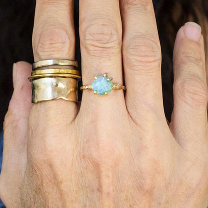 Zambian Emerald Small Stone Ring on a Yellow Gold Embedded Band