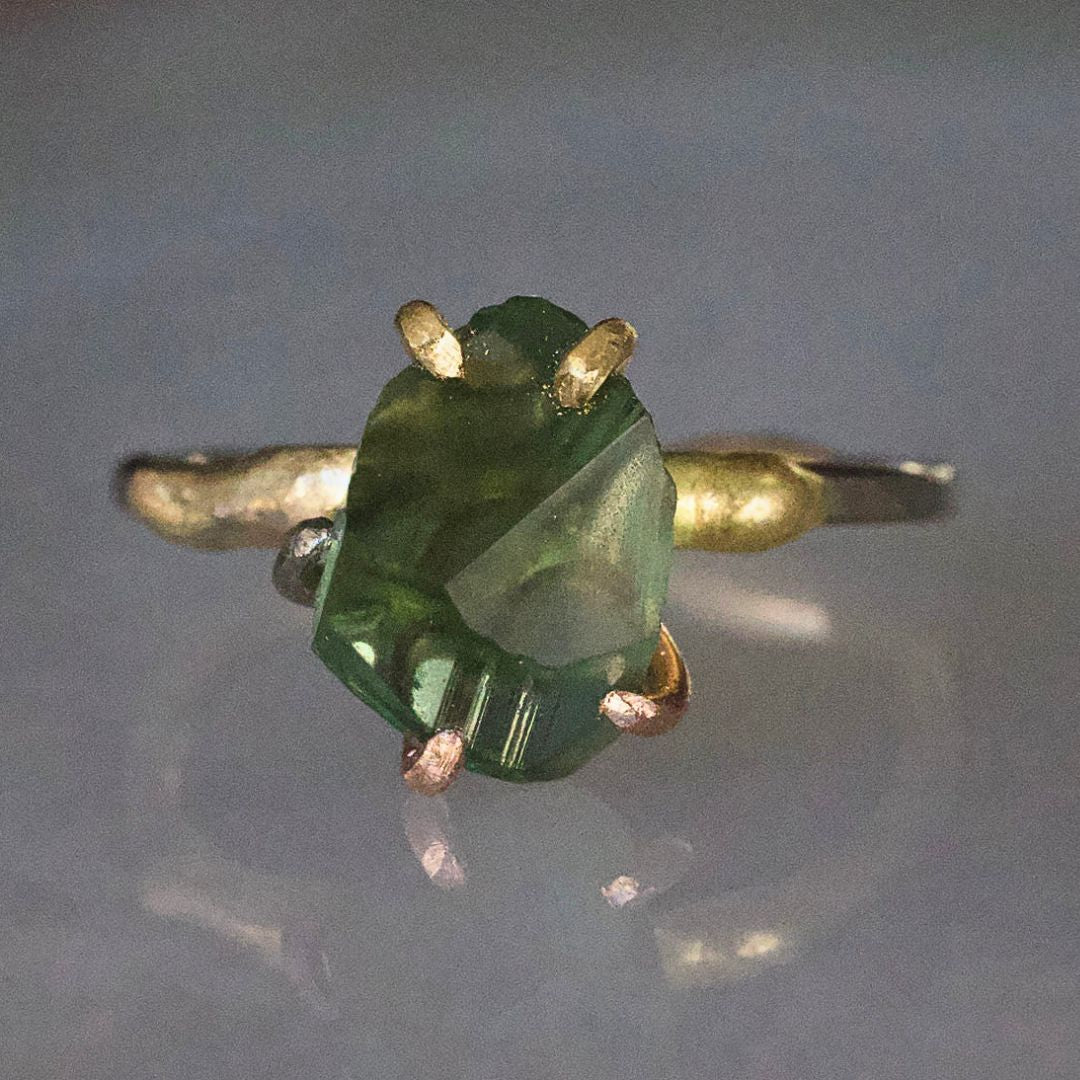 Green Tourmaline Small Stone Ring on a Yellow Gold Embedded Band