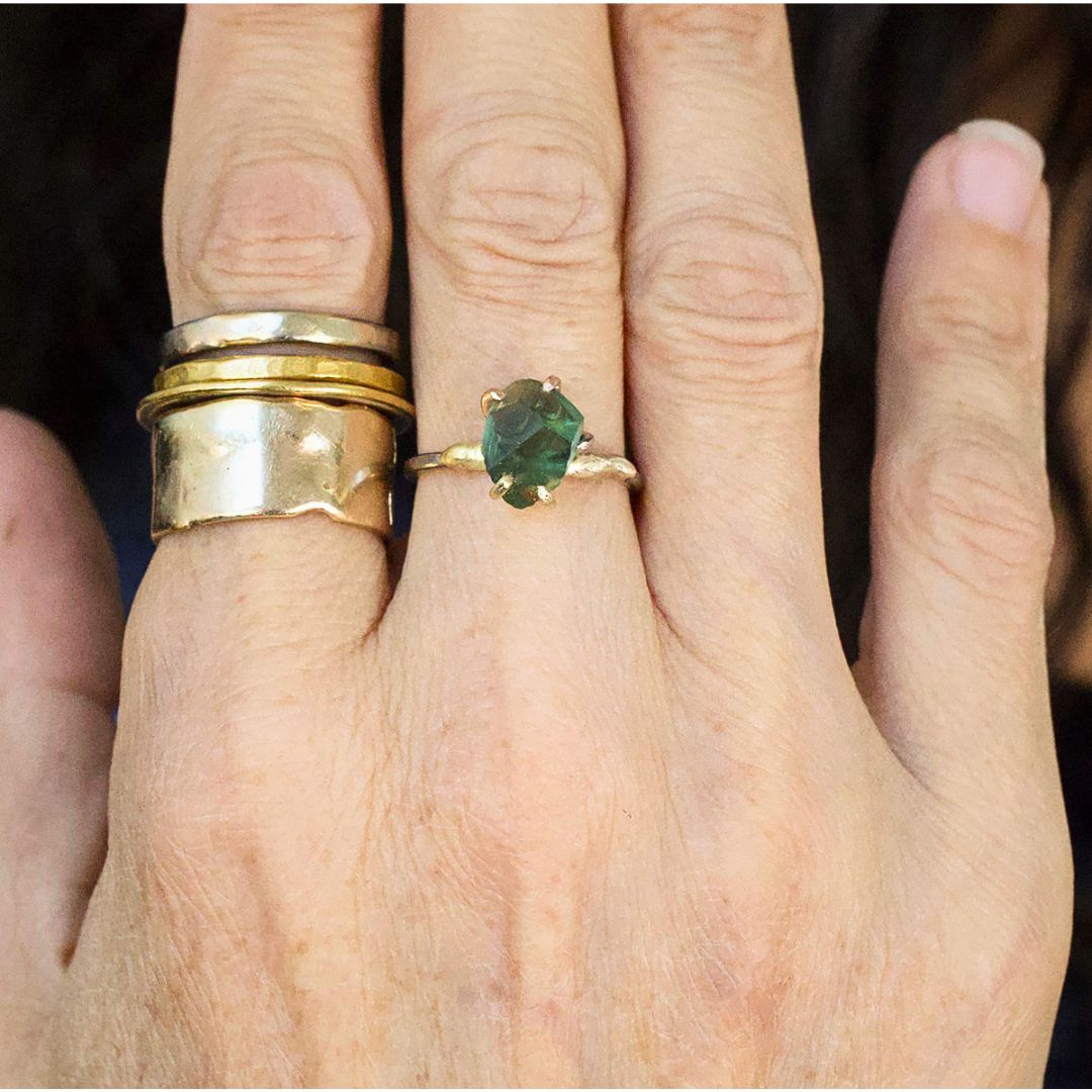 Green Tourmaline Small Stone Ring on a Yellow Gold Embedded Band